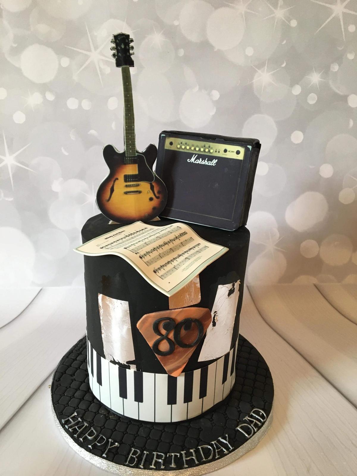 Bespoke celebration cake with intricate floral icing and gold accents, crafted in Solihull, West Midlands.