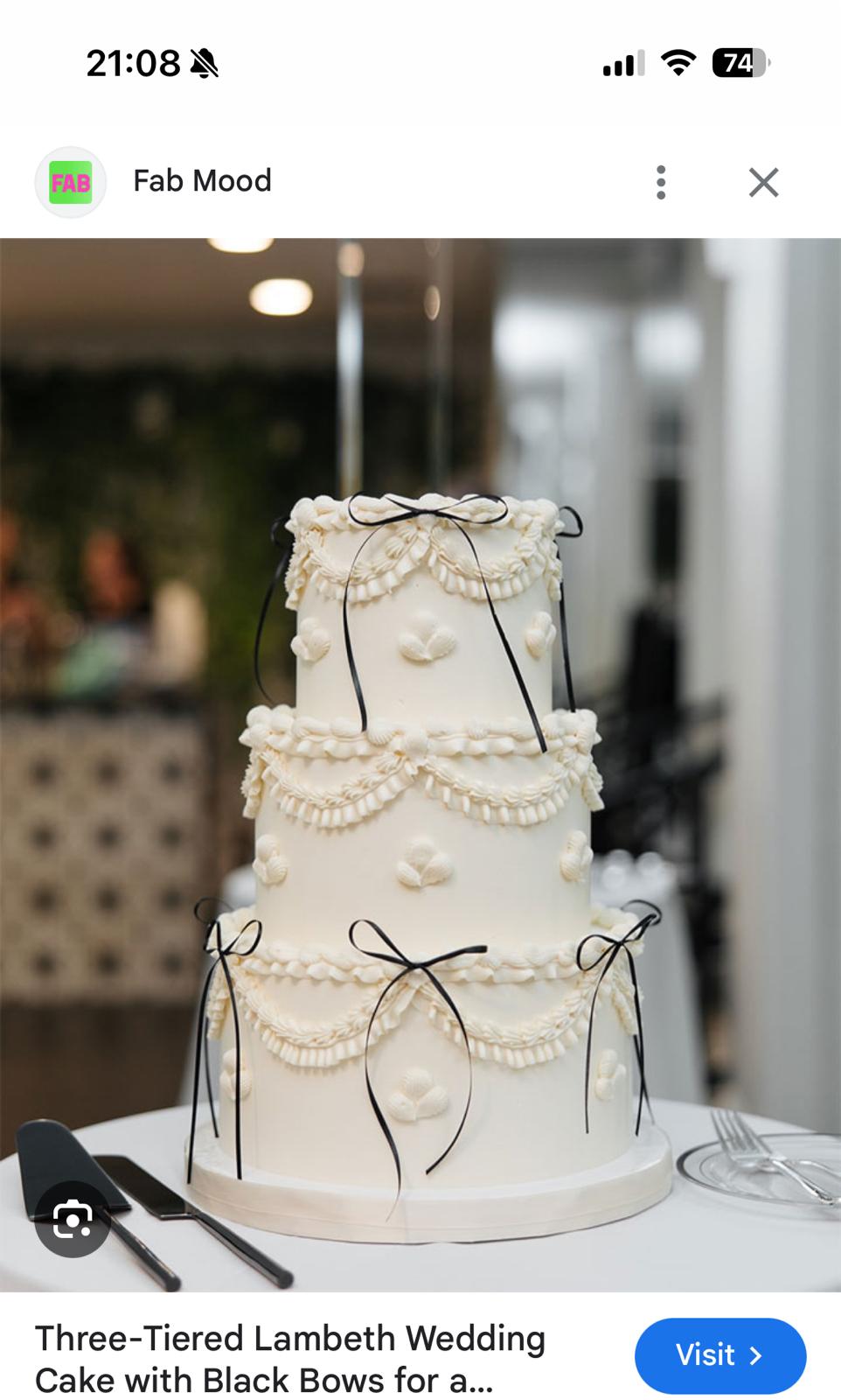Bespoke celebration cake with intricate floral designs and gold accents in Solihull, West Midlands.