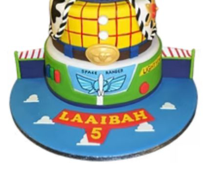 Bespoke celebration cake with intricate floral piping and gold accents, crafted in Solihull, West Midlands.