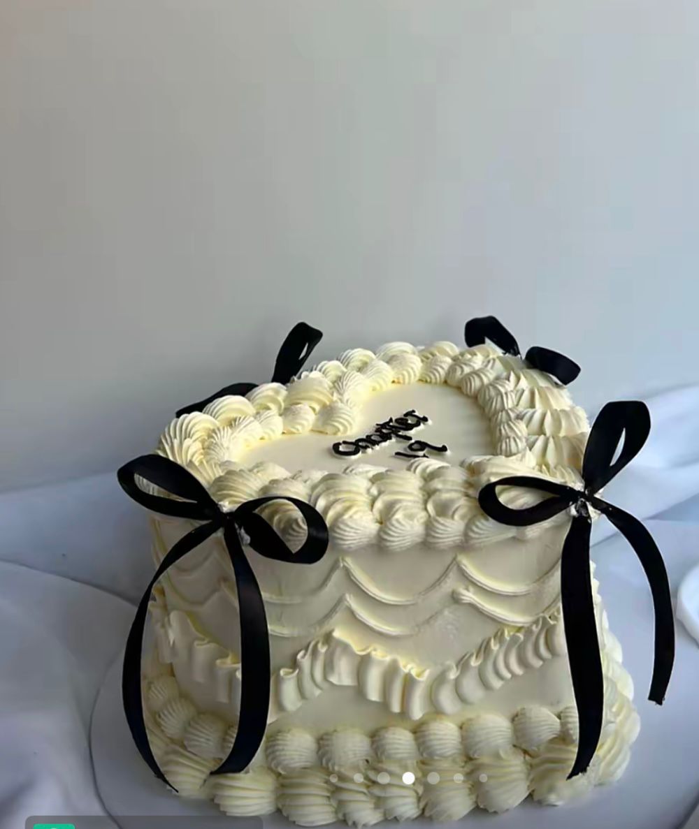 Bespoke cake with intricate floral icing and delicate piping, perfect for celebration in Solihull, West Midlands.