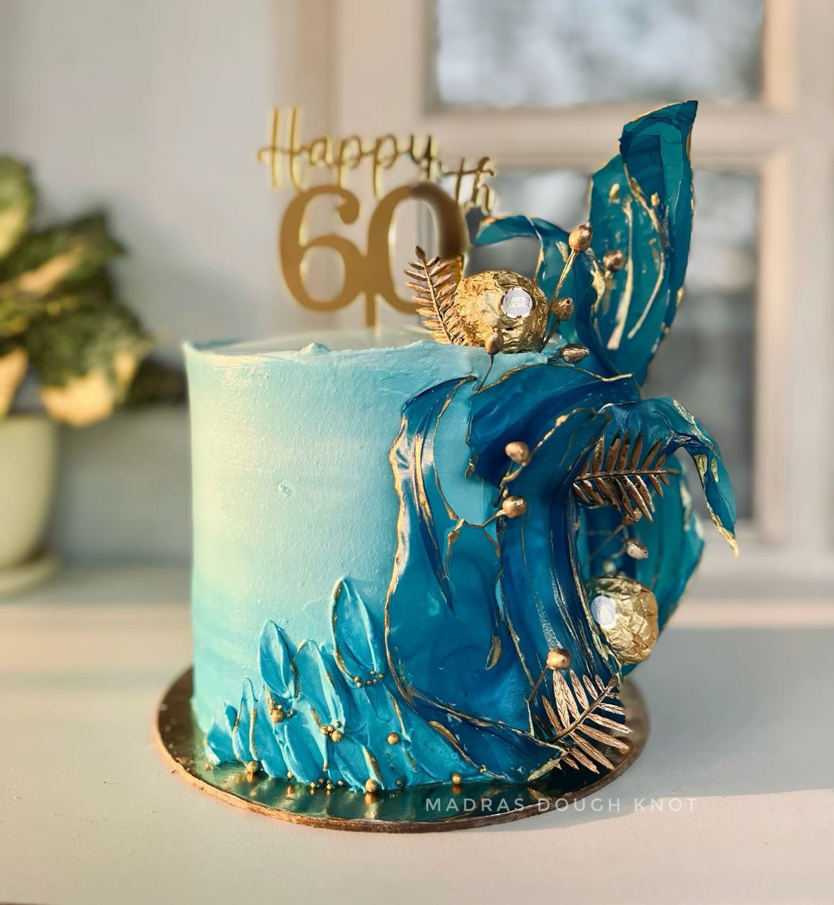 Bespoke single-tier cake with elegant white icing and delicate floral decorations, Solihull, West Midlands.