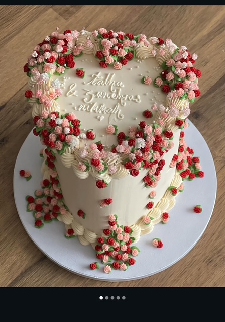 Bespoke celebration cake with intricate floral icing and gold accents, crafted in Solihull, West Midlands.