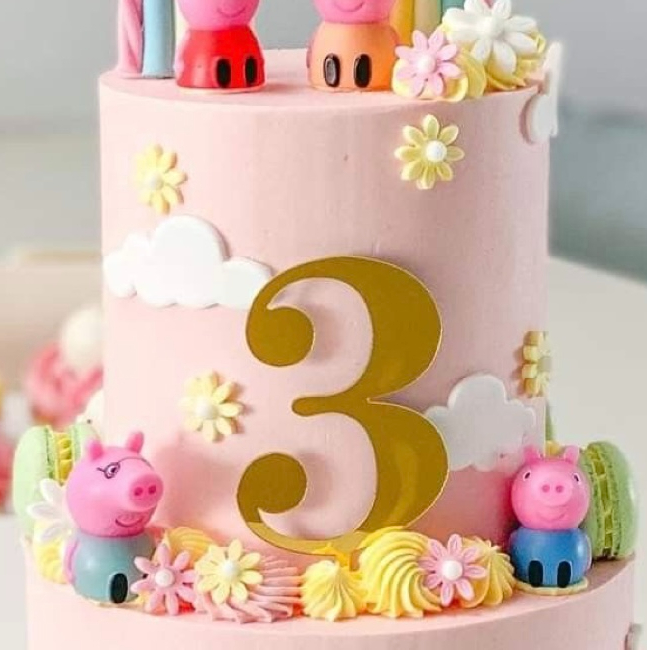 Bespoke celebration cake with intricate floral design and gold accents in Solihull, West Midlands.