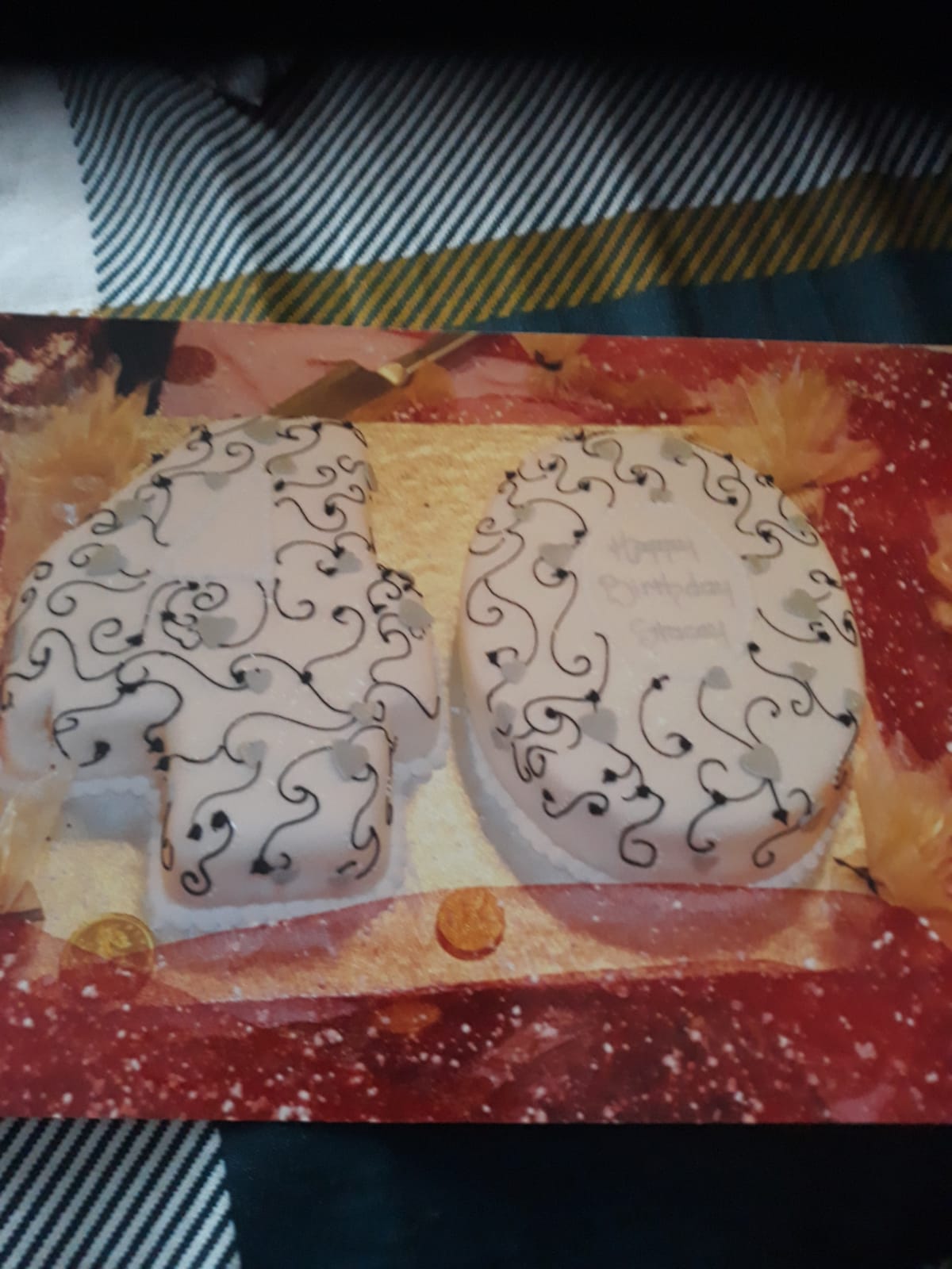 Bespoke single-tier cake with elegant white icing and delicate floral decorations, made in Solihull, West Midlands.