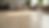 Close-up view of luxury vinyl plank flooring with a light wood finish in a Florida living room