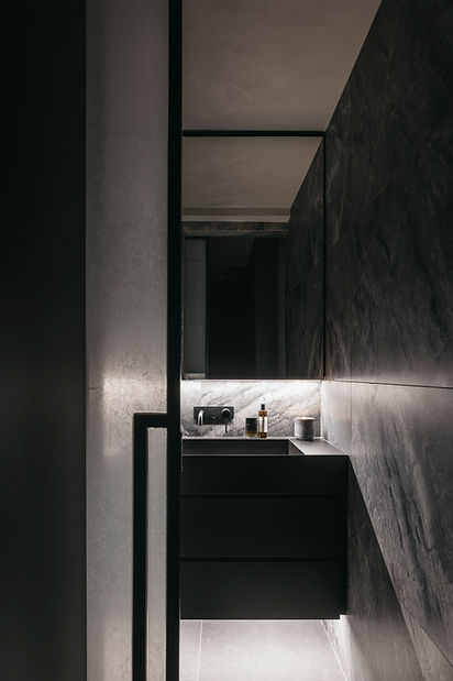 Dark Japanese interior design by Studio Metanoia, showcasing contemporary elements in a Singapore condominium