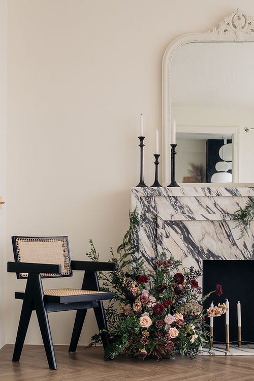 Clarice in Paris, a Parisian-inspired condominium renovation by Studio Metanoia, features a chic blend of minimalist design and vintage elegance. This 1130-sqft home showcases custom marble elements, a statement fireplace, herringbone flooring, and luxurious finishes, including a chandelier, black oak furnishings, and brass accents. The open-concept living space is bathed in natural light, while personal touches from the homeowners' travels add unique charm. A sophisticated Parisian powder room and master bedroom with French linen bedding complete the home's timeless yet contemporary aesthetic.