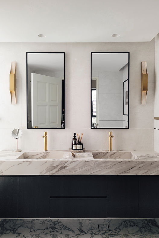 Clarice in Paris, a Parisian-inspired condominium renovation by Studio Metanoia, features a chic blend of minimalist design and vintage elegance. This 1130-sqft home showcases custom marble elements, a statement fireplace, herringbone flooring, and luxurious finishes, including a chandelier, black oak furnishings, and brass accents. The open-concept living space is bathed in natural light, while personal touches from the homeowners' travels add unique charm. A sophisticated Parisian powder room and master bedroom with French linen bedding complete the home's timeless yet contemporary aesthetic.