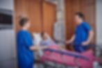 Patient receiving care from medical team following endoscopic polypectomy