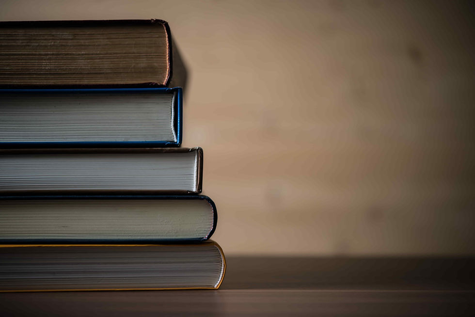 stack-of-old-books-on-wooden-surface-2026-03-17-01-36-28-utc (1).jpg