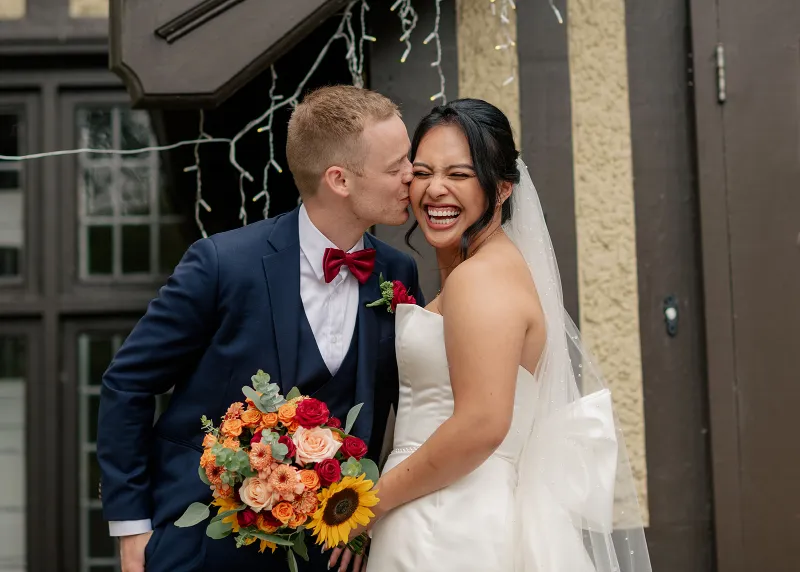 groom kissing bride during a summer wedding in Hart House, Burnaby, British Columbia