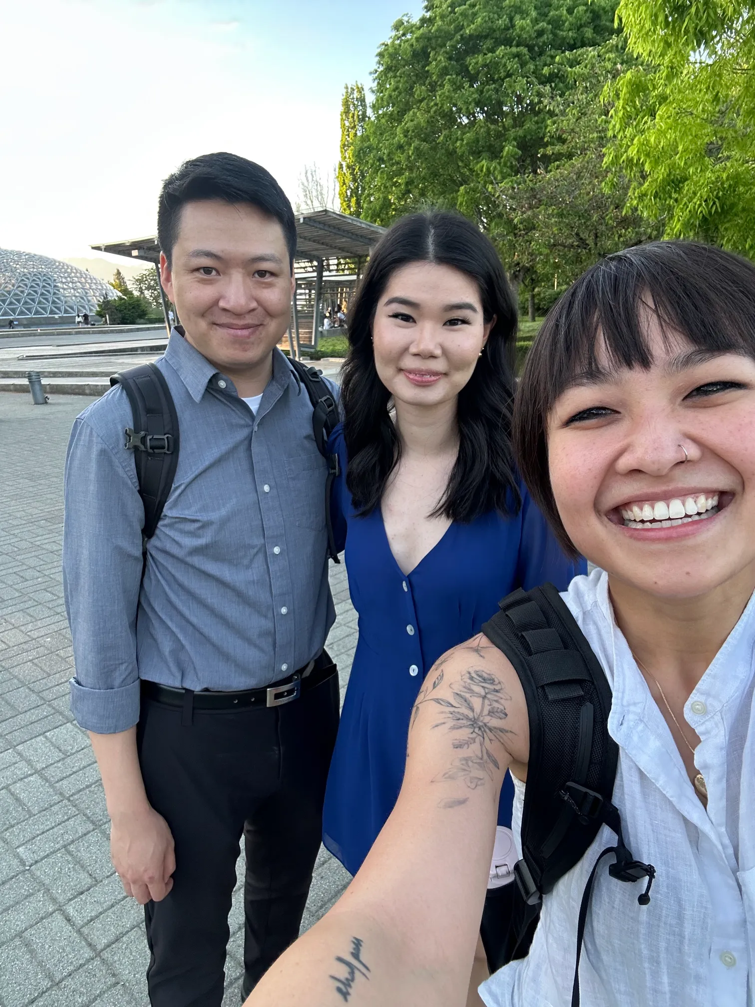 A selfie of Anne Nguyen and engaged couple