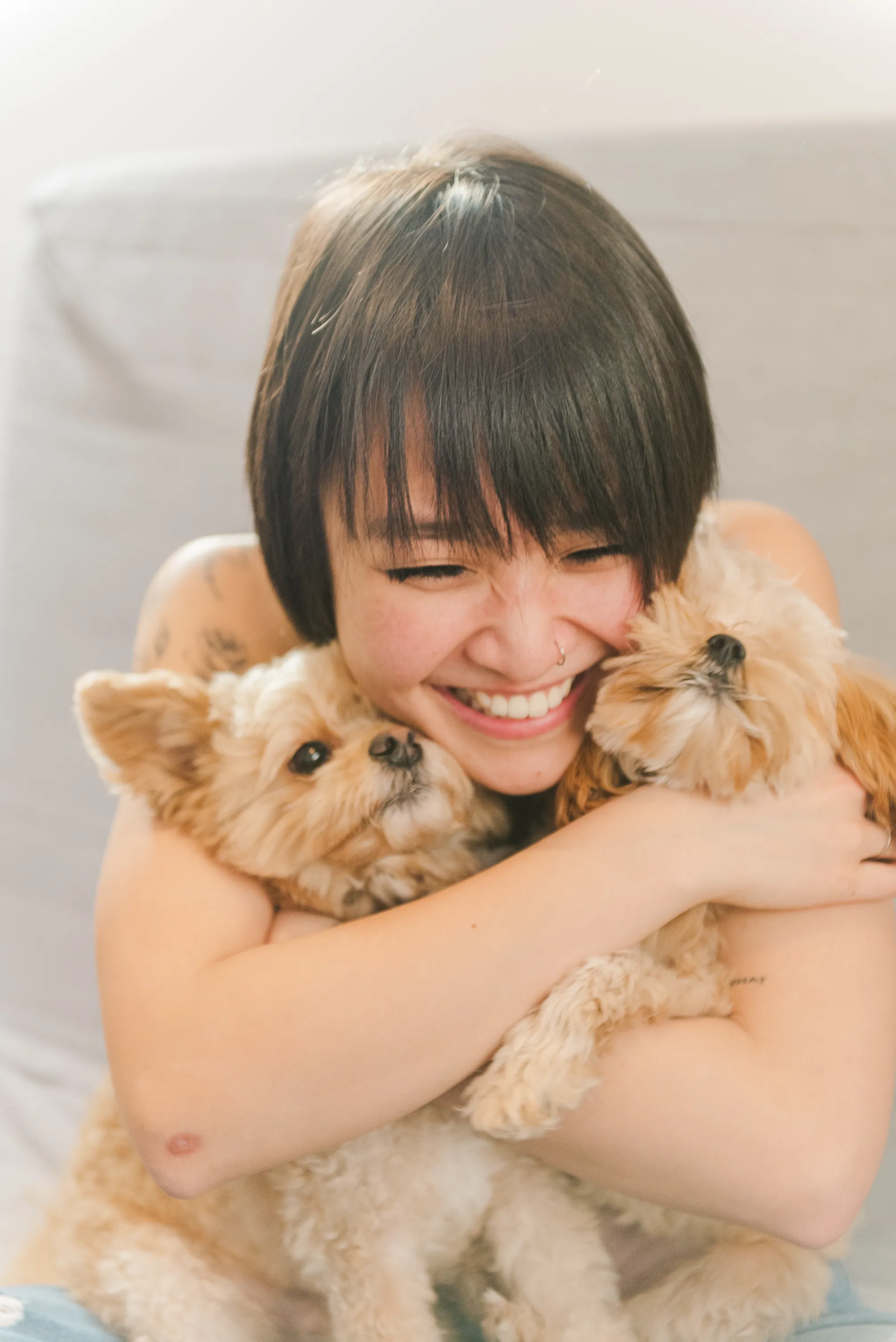 Anne Nguyen holding her two puppies in Vancouver British Columbia
