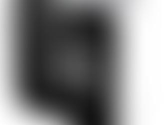 White air quality monitor displaying AQI of 29 on a black screen. Battery symbol visible. Green indicator light on top.