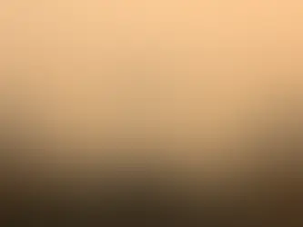 A hazy morning at India Gate, New Delhi, with people walking through dense smog, highlighting severe air pollution conditions.