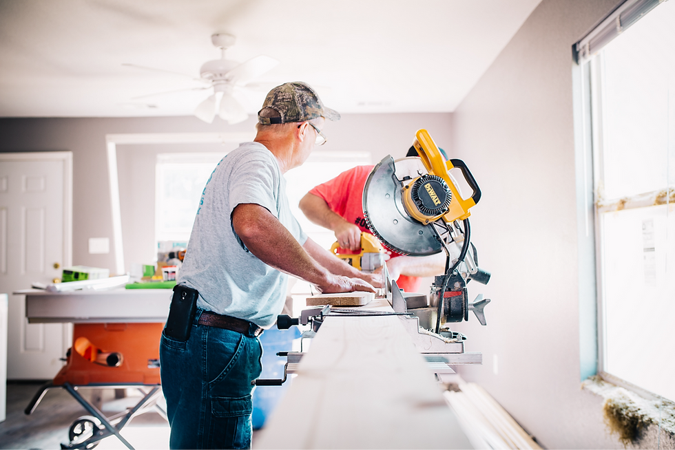 man standing infront of miter saw_edited_edited.png
