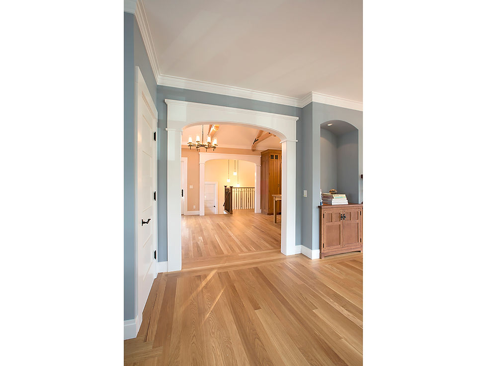 An abundance of period architectural detailing, custom cabinetry in the living room and inviting paint colors.
