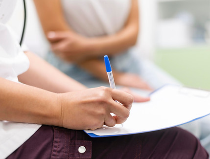 doctor-checking-medical-form-with-patient.jpg