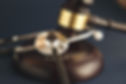 midsection-judge-striking-mallet-with-stethoscope-desk-courtroom.jpg