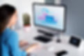 Woman using computer, website hosting
