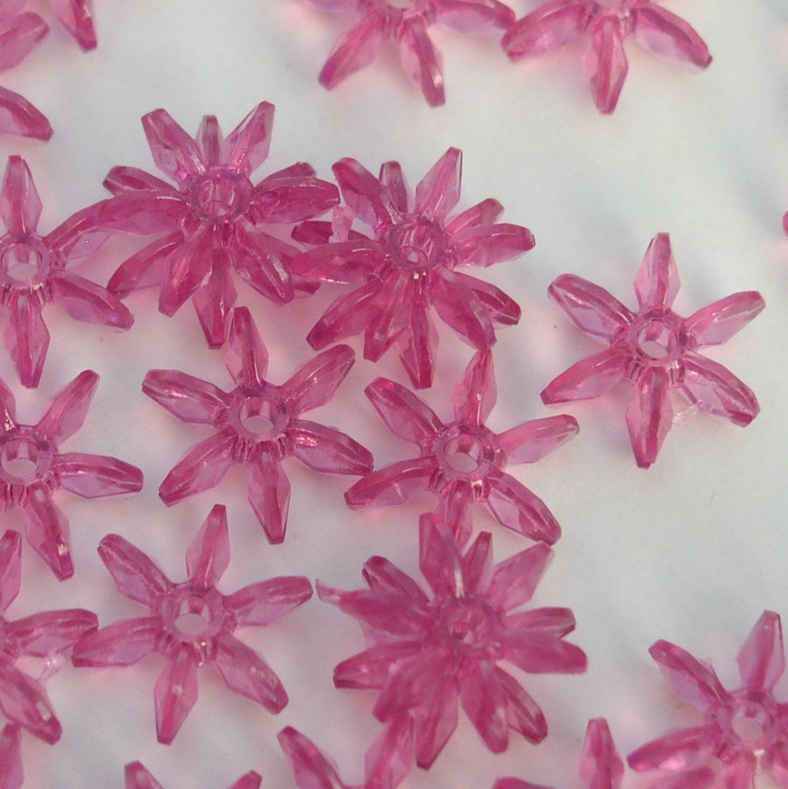 #16 - Transparent Mauve 12mm Starflake Beads