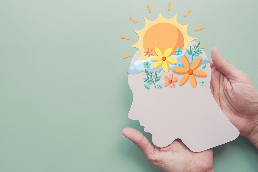 Person with long blonde hair drinking water from clear glass, wearing grey shirt. Close-up shot with soft lighting, calm mood.