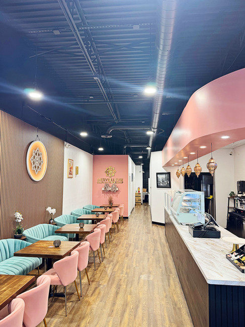 Interior of Merveilleuse Crêpes and Coffee Shop in Destin, Florida, featuring soft feminine décor, handcrafted coffee, and freshly made French-inspired crêpes.