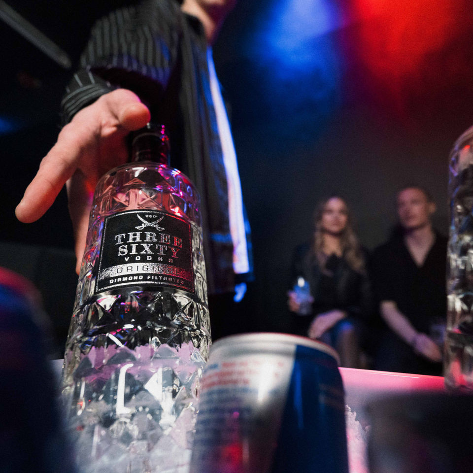 THREE SIXTY BOTTLE BEING GRABBED