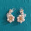 Thumbnail: Total White Golden flowers earrings