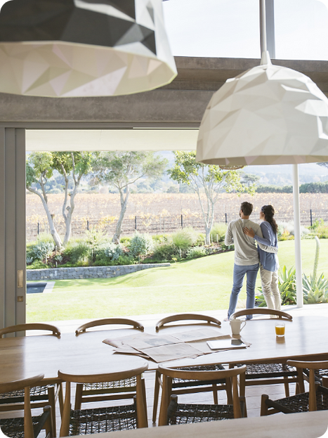 couple standing together admiring beautiful backyard