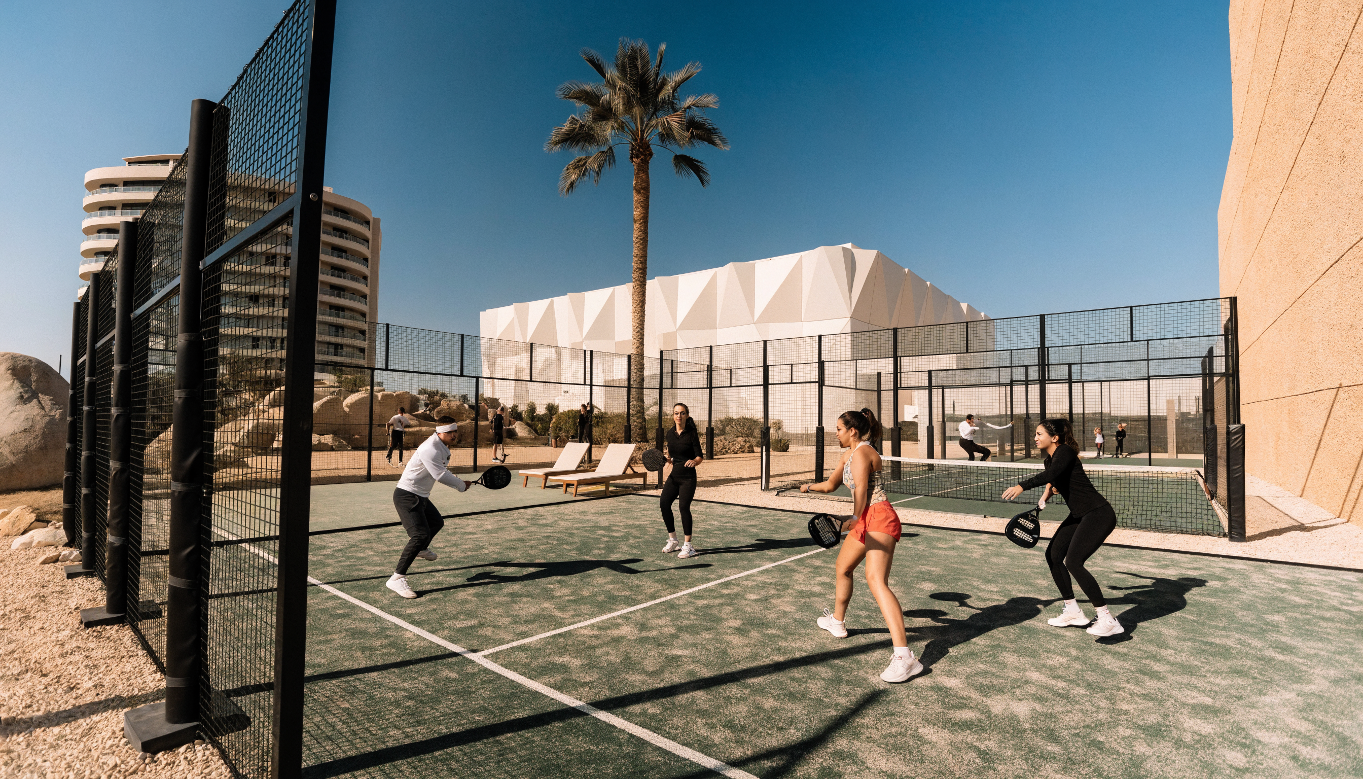 Outdoor padel court in Dubai on a sunny winter day