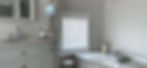White internal shutters in contemporary bathroom with marble counters
