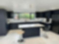 charcoal kitchen cabinets with glossy white counter tops