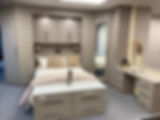 bedroom with fitted cabinets