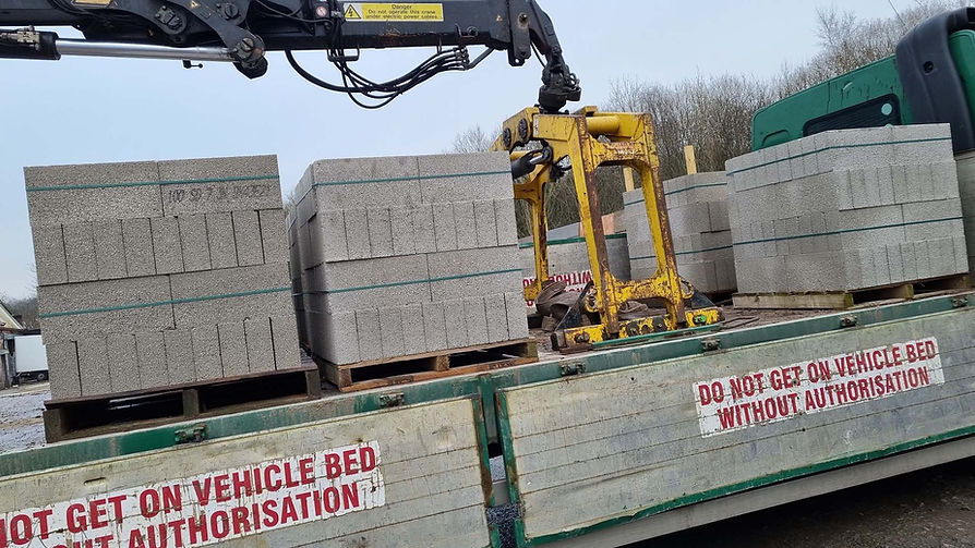 bricks being delivered on back of lorry with crane