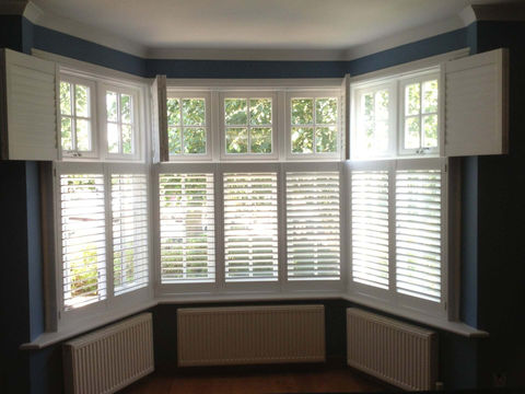 Bay window with tier on tier shutters