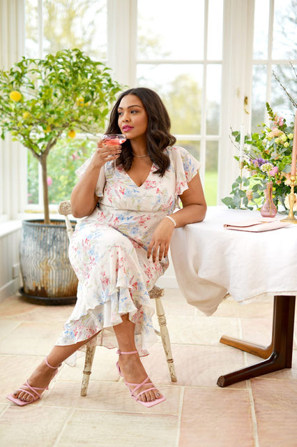 Model sat on a chair