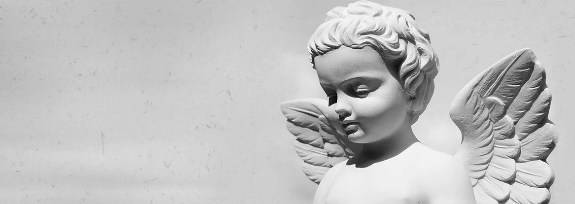 detail of sculpture on monumental cemetery in Italy