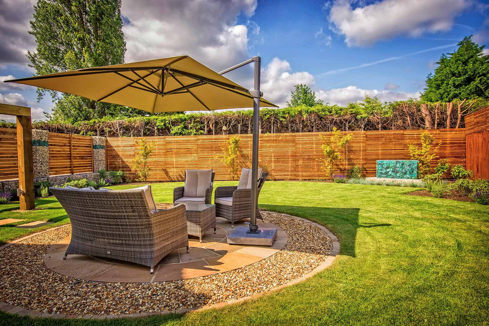 Modern canopy over garden furniture on circular patio