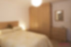 Bedroom with wooden cupboards