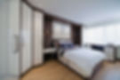 Bedroom with hinged-door wardrobes