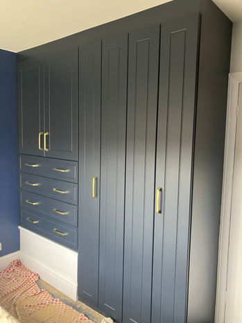 Indigo blue pencil routed with gold handles, fitted over a stair box