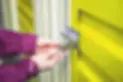 Person locking a storage unit