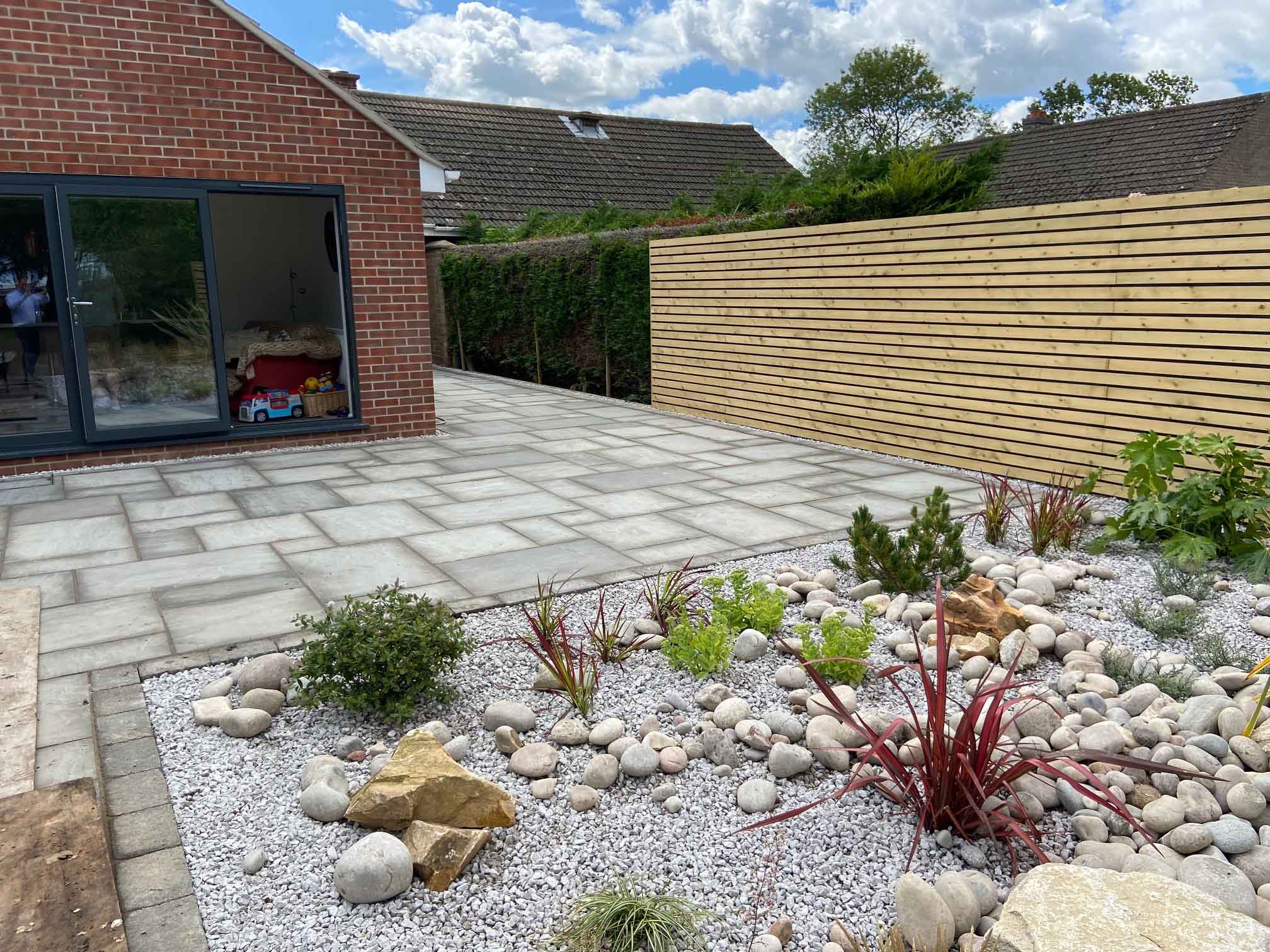 Gravel garden area with patio and new fence