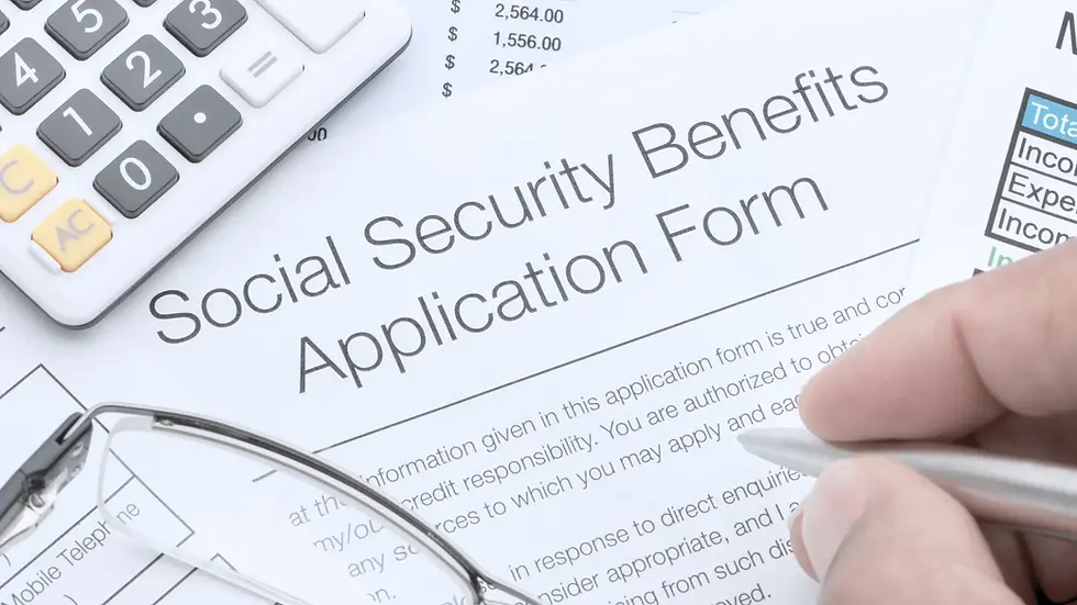 Close up of a social security benefits application form with calculator and pen in hand, depicting the application process before being denied ssdi benefits.