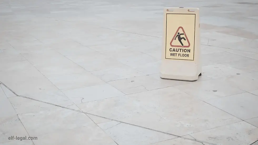 Wet floor hazard sign in Georgia workplace representing common slip and fall workplace injuries
