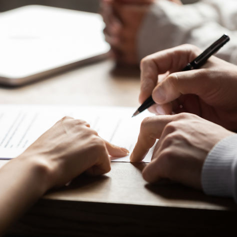 Injured Georgia worker discussing workers' compensation benefits with an attorney at The Edmonson Law Firm in Buford, GA