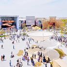 People gather in a busy outdoor plaza_ed