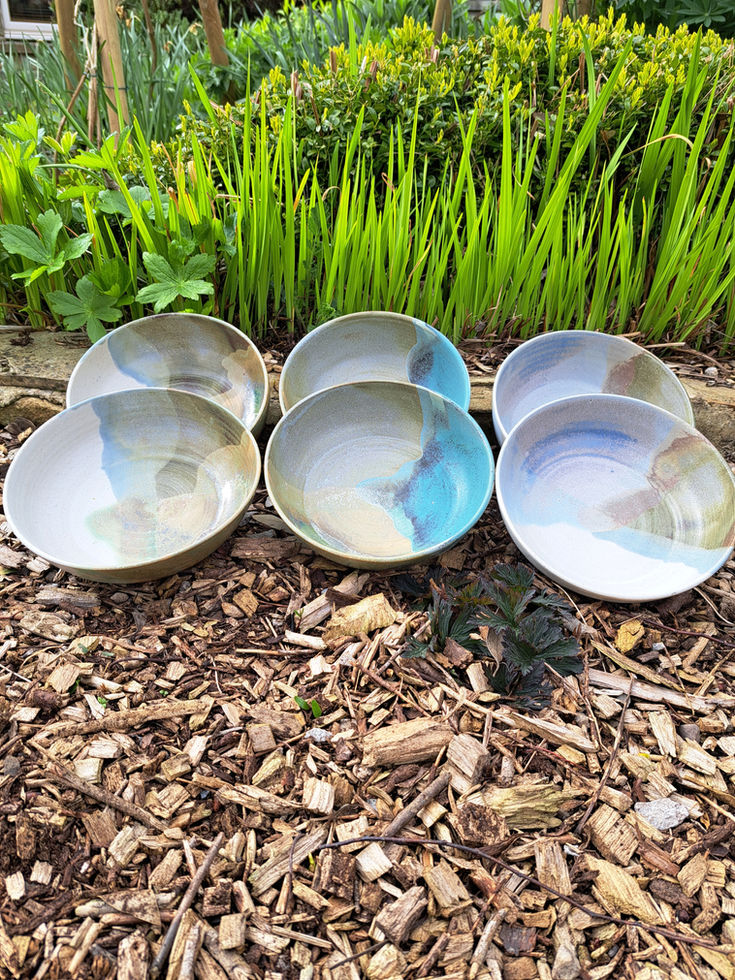 Set of ceramic breakfast bowls with layered blue and beige glaze finish, made in Northumberland