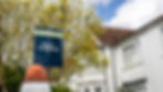 For Sale board outside home